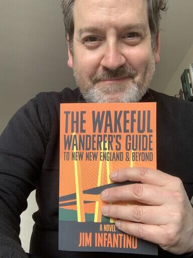 Adam Schartoff with Wakeful Wanderer book