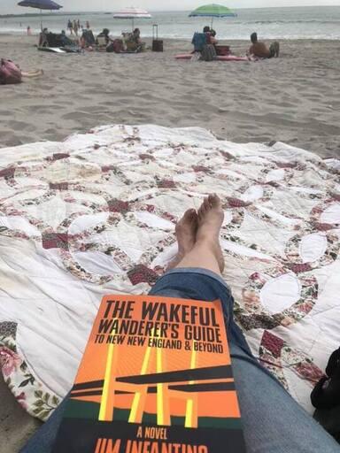 Wakeful Wanderer paperback at the beach